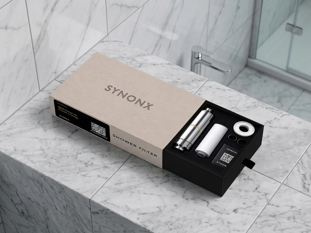 SYNONX Shower Filter box open on marble bathroom counter