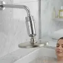 Woman showering with SYNONX filter